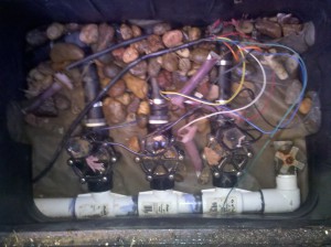 Valve box with 3 zone valves and one drain valve.